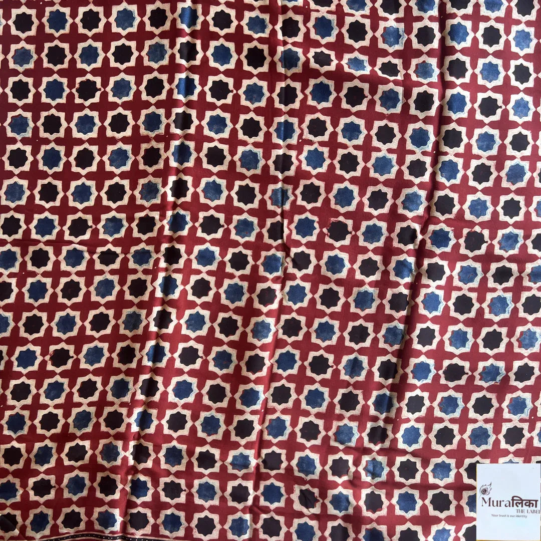 Ajrakh hand block printed Modal silk saree by Muralika the Label featuring intricate traditional geometric patterns and vibrant colors.