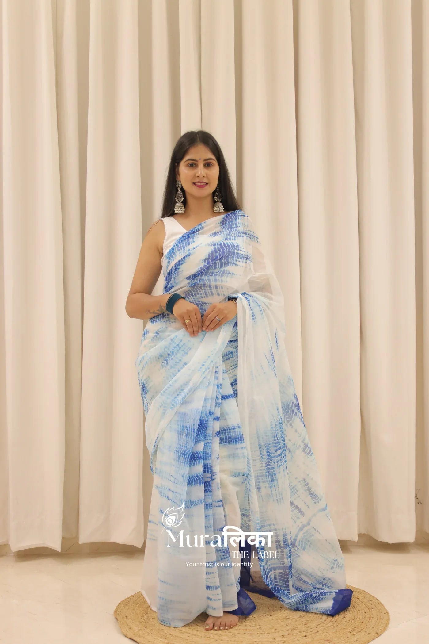 Neel Blue hand-dyed Shibori Bandhej chiffon saree by Muralika the label, showcasing intricate dye patterns and lightweight fabric.