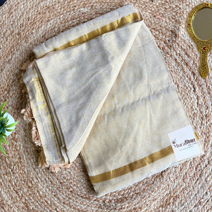 Sunehri cream tissue saree folded to show the blouse piece
