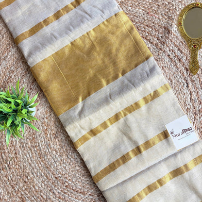 Detail of the gold zari border on the Sunehri cream tissue saree