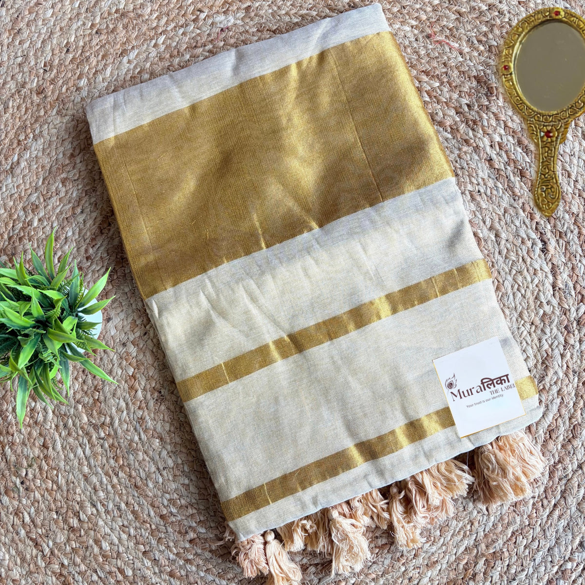 Sunehri cream and gold tissue saree pallu with gold tassels