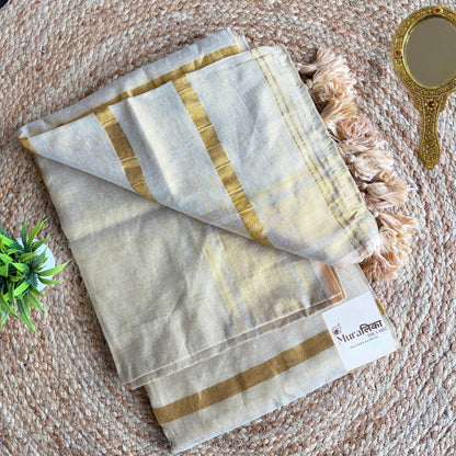 Gold zari border and pleats of the Sunehri cream tissue cotton saree