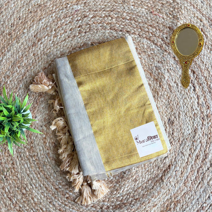 Close view of the cream tissue cotton weave on the Sunehri saree