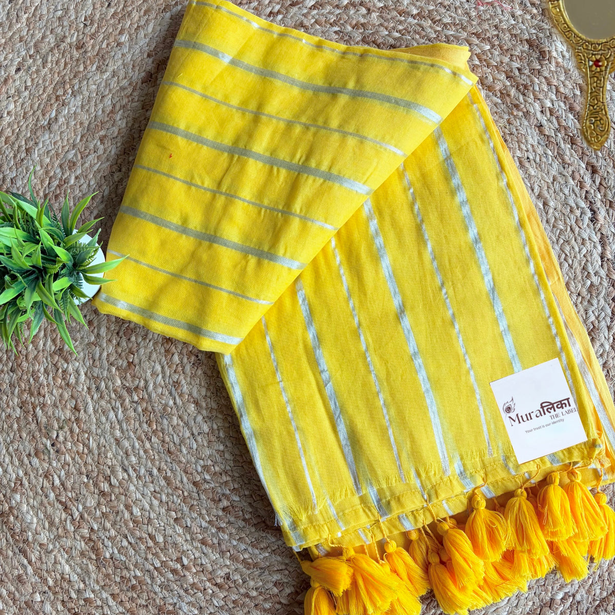 Haldi yellow striped mulmul cotton saree shown draped