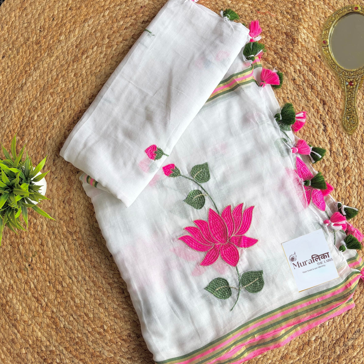 Kamal Talai lotus embroidered white mulmul cotton saree shown draped