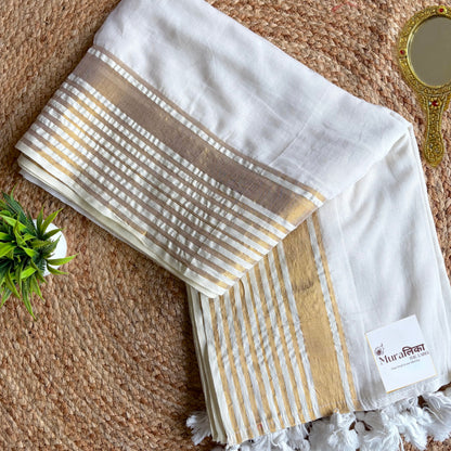 Close view of the gold zari stripes on the Shwet white mulmul cotton saree