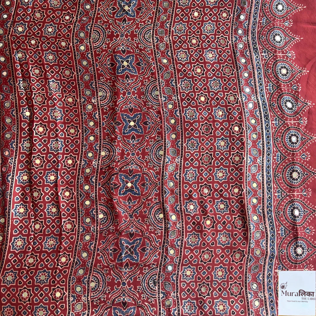 Ajrakh mirror work Modal silk saree by Muralika the Label featuring traditional block print and intricate mirror embellishments.