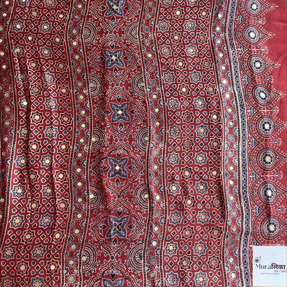 Ajrakh mirror work Modal silk saree by Muralika the Label featuring traditional block print and intricate mirror embellishments.