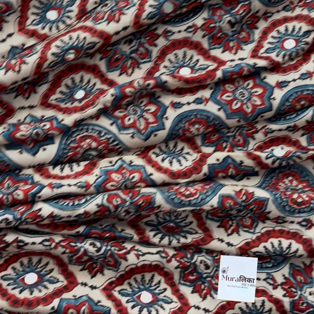Naina cream Ajrakh saree draped, showing the cream-ground medallion block print