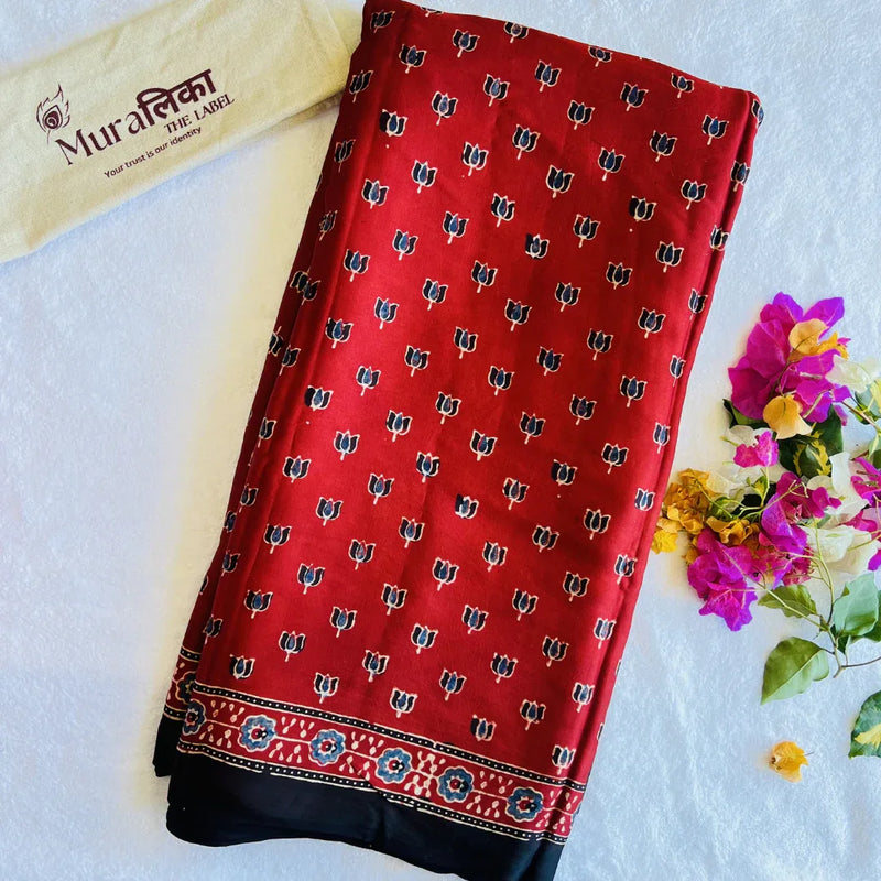 Ajrakh hand block printed modal silk saree by Muralika the label featuring intricate traditional geometric patterns.