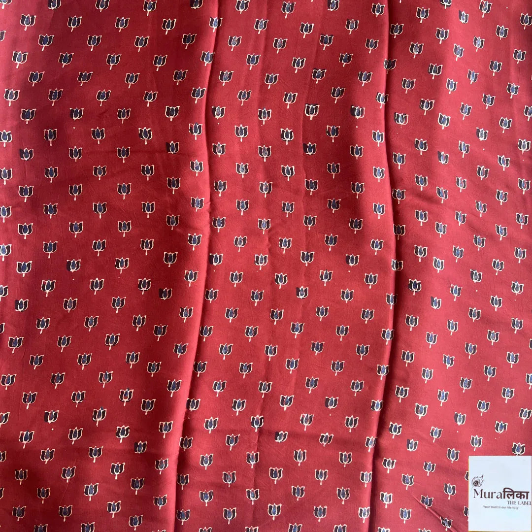 Ajrakh hand block printed modal silk saree by Muralika The Label, showcasing intricate traditional patterns and vibrant colors.