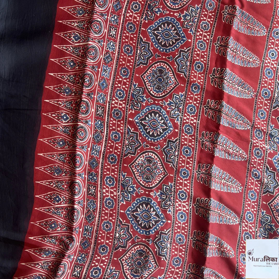 Ajrakh hand block printed modal silk saree from Muralika the label, showcasing intricate traditional geometric patterns.