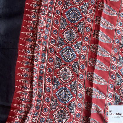 Ajrakh hand block printed modal silk saree from Muralika the label, showcasing intricate traditional geometric patterns.