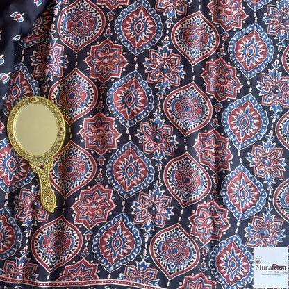 Elegant Ajrakh mirror work Modal silk saree by Muralika the Label, featuring intricate traditional mirror embroidery and rich fabric.