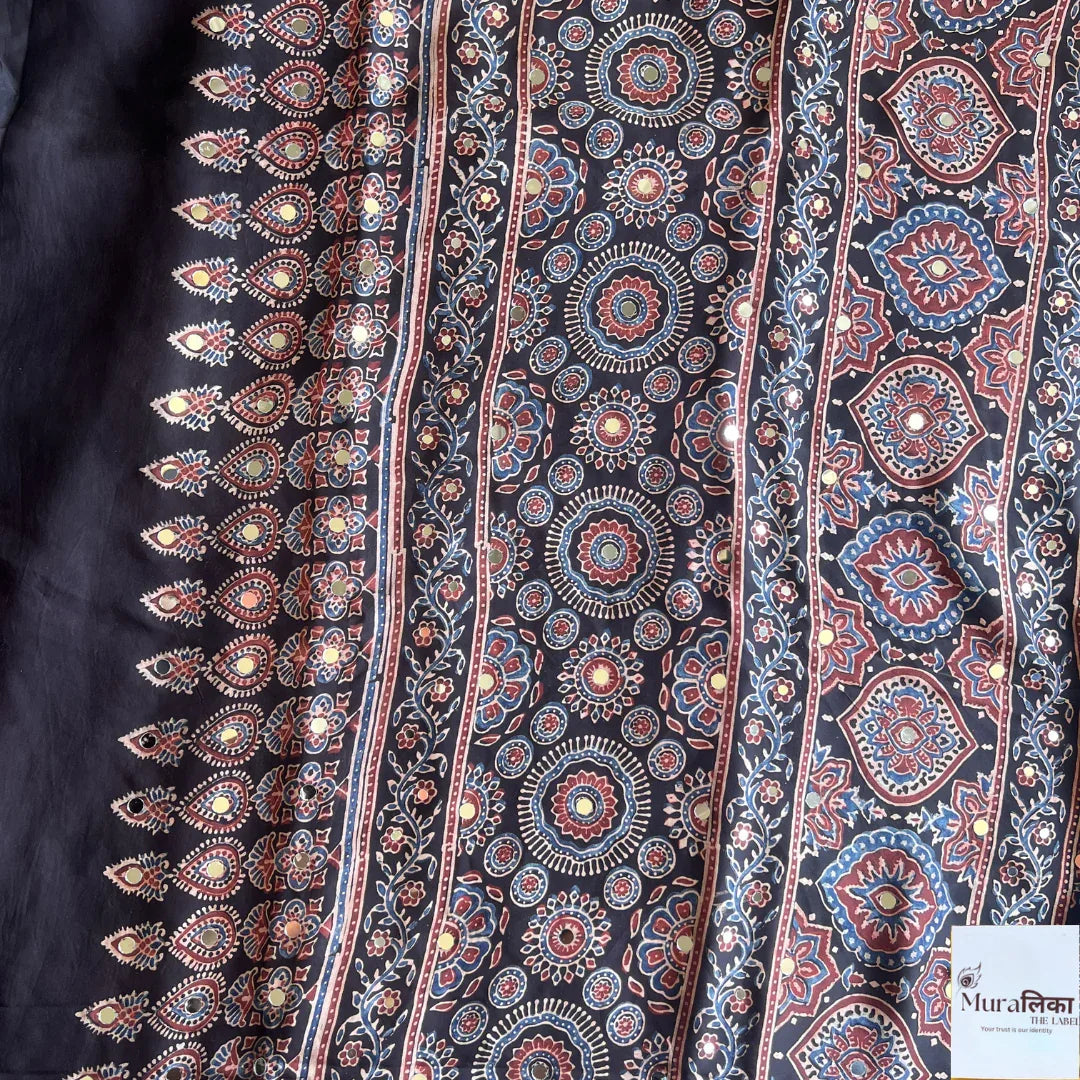 Elegant Ajrakh mirror work Modal silk saree by Muralika The Label with intricate traditional patterns and vibrant colors.