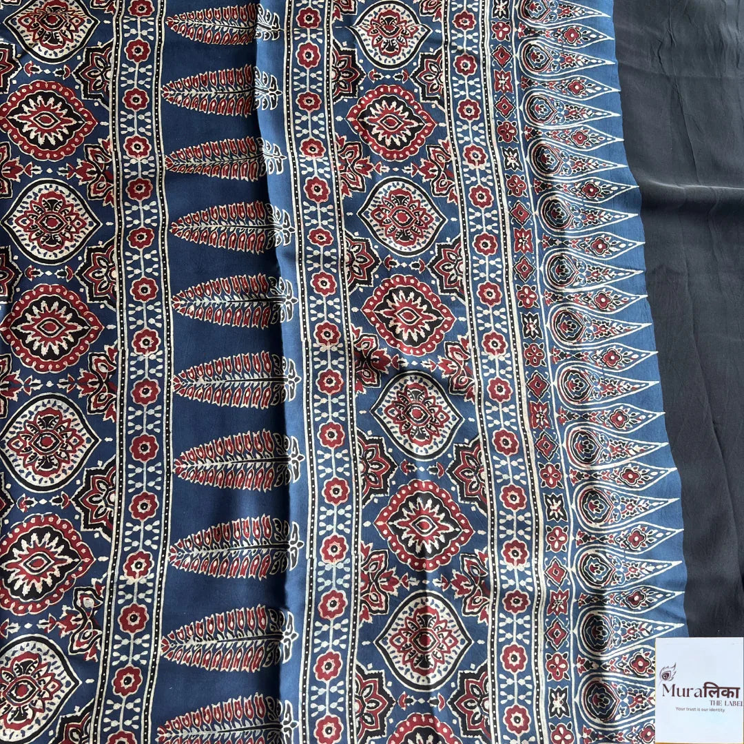 Ajrakh hand block printed Modal silk saree by Muralika The Label featuring intricate traditional patterns and vibrant colors.