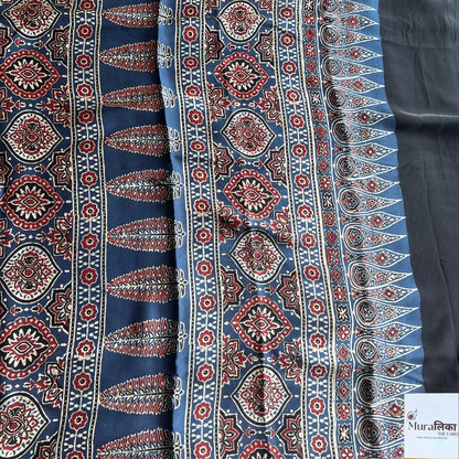 Ajrakh hand block printed Modal silk saree by Muralika The Label featuring intricate traditional patterns and vibrant colors.