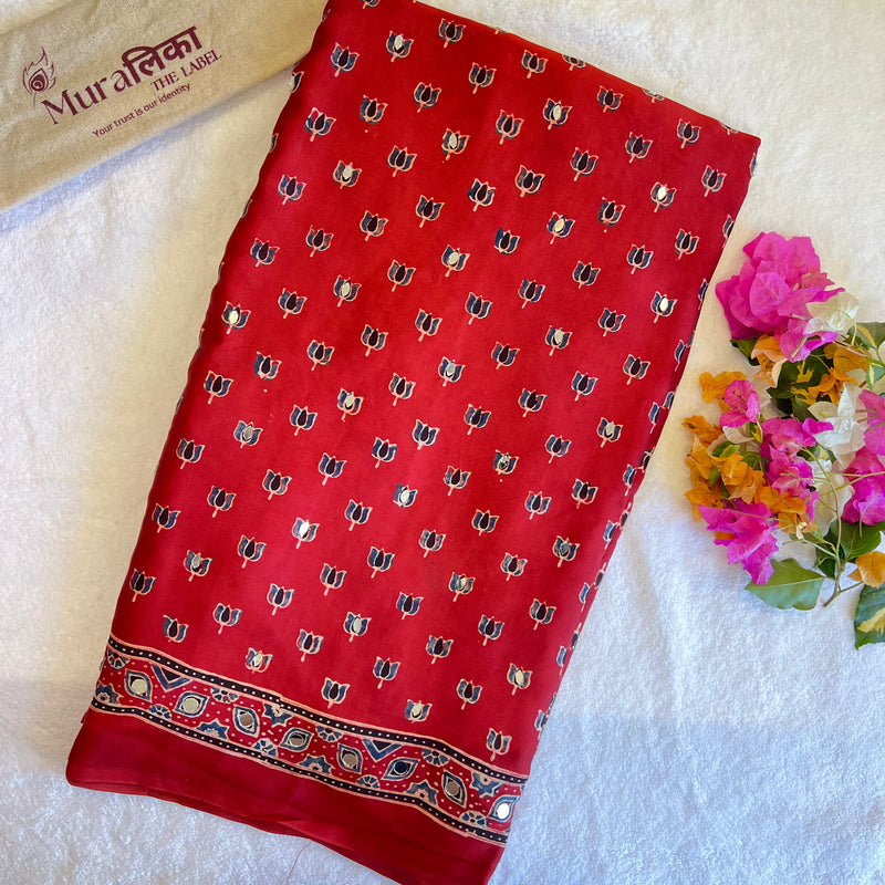 Elegant Ajrakh mirror work Modal silk saree by Muralika The Label featuring intricate mirror embroidery and vibrant traditional patterns.
