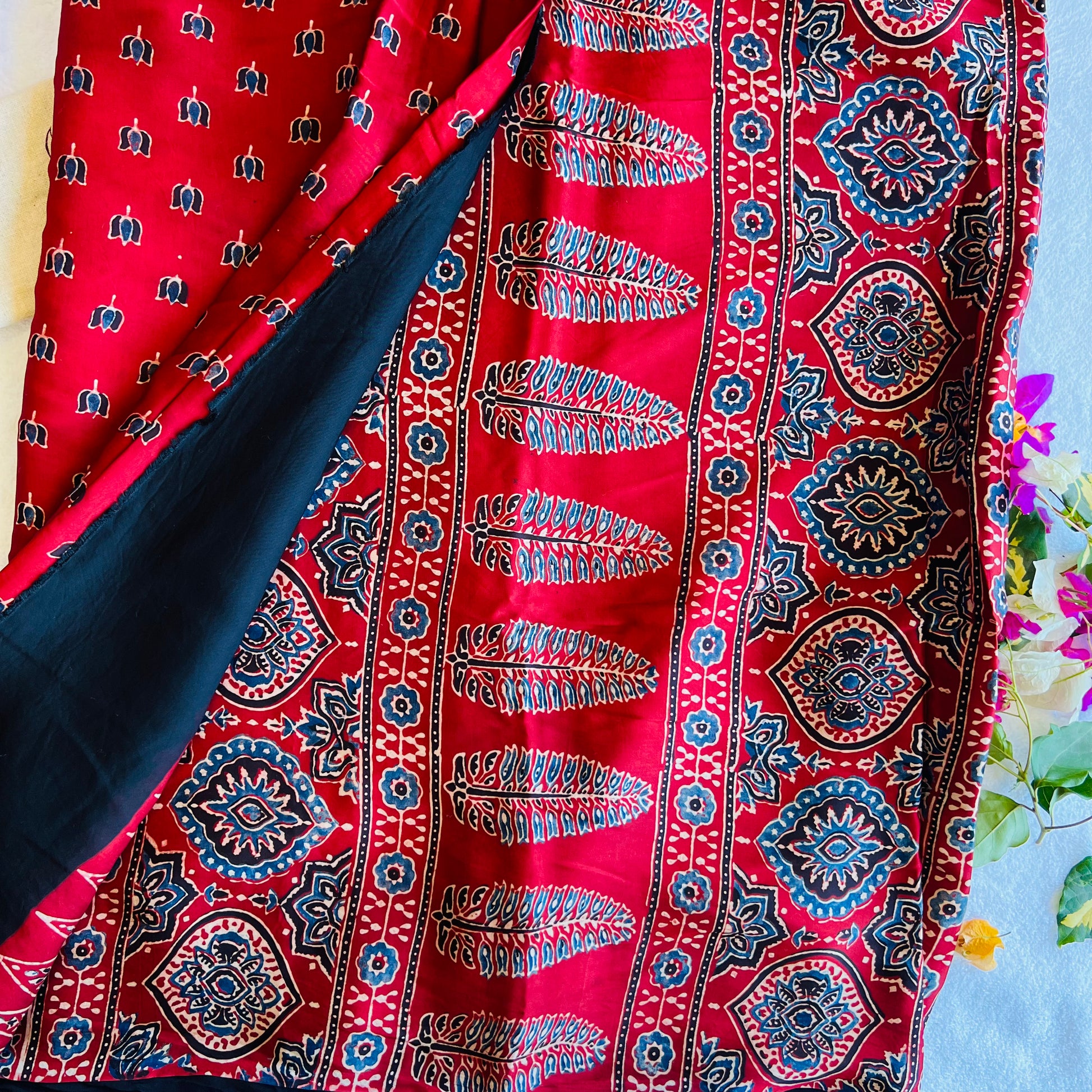 Ajrakh hand block printed modal silk saree by Muralika the label with intricate geometric patterns and vibrant colors.