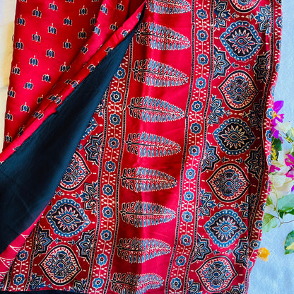 Ajrakh hand block printed modal silk saree by Muralika the label with intricate geometric patterns and vibrant colors.