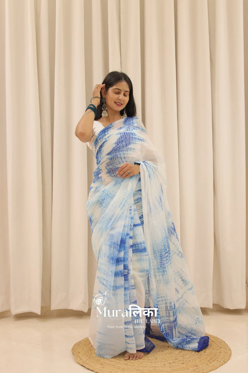Neel blue hand-dyed Shibori Bandhej chiffon saree from Muralika the label with intricate tie-dye patterns and lightweight fabric.